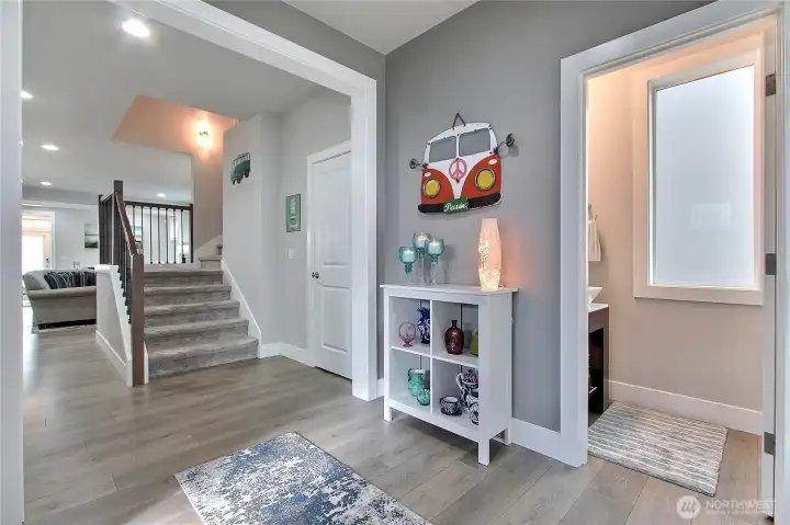 Typically, an entryway supports one closet, often a coat closet or small storage space for shoes and outerwear. Some larger or more luxurious homes may have two closets, but that’s less common.    This entryway, however, features two large closets, one on each side, offering exceptional storage, balance, and convenience for coats, shoes, or seasonal gear. It’s a thoughtful design touch that immediately elevates functionality while maintaining a spacious, welcoming feel.