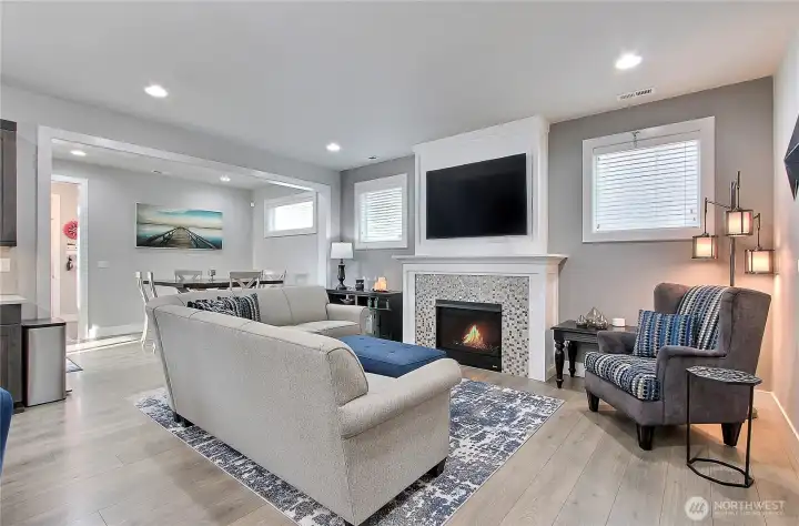 This cozy gathering space is the heart of the home, radiating warmth and comfort with a sleek gas fireplace. Perfect for movie nights or game days, the included 65-inch TV makes entertaining effortless. Thoughtfully designed to flow with the property, it’s a space where family and friends will naturally come together, creating memories that linger long after the fire dies down.