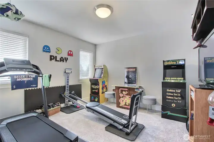 The second bedroom is another generously sized space, complete with a supporting walk-in closet, offering both comfort and ample storage for family, guests, or a versatile use like a home office or hobby room.