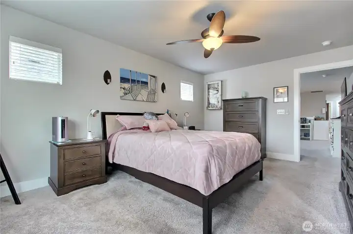 The primary bedroom is discretely tucked in the back of the home, offering added privacy and a suite-like feel. This is truly the owner’s retreat, your private oasis awaits, a serene space to relax, recharge, and enjoy every day in comfort.