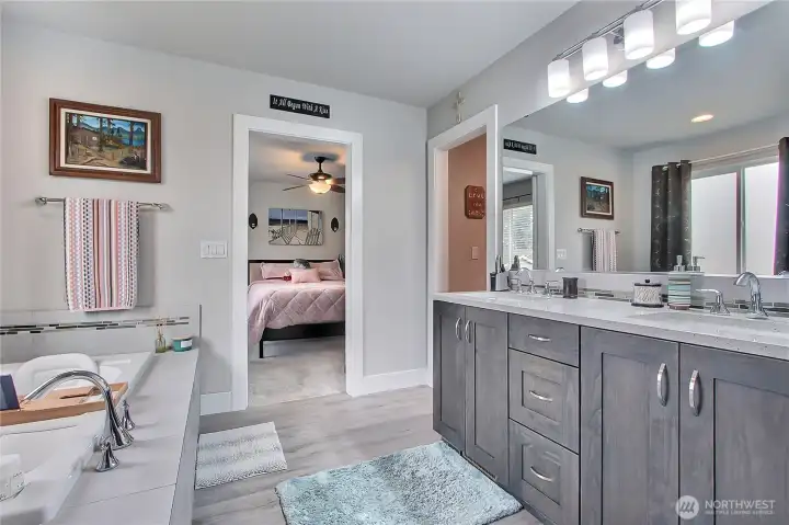 This 5-piece master suite highlights the beauty and craftsmanship of the home. Elegant tile finishes perfectly frame the space, adding sophistication and a polished, luxurious feel that makes this suite a private sanctuary.