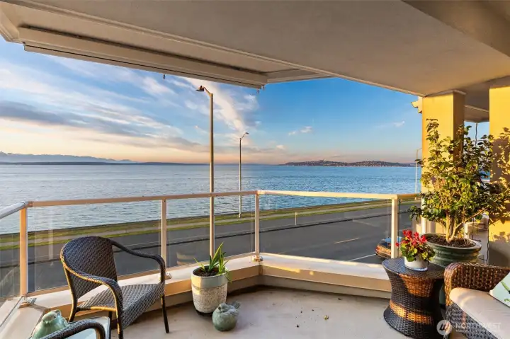 The covered view deck is easily accessible from both the living room and the primary suite, creating a seamless indoor-outdoor connection and offering the perfect setting to relax, entertain, or simply take in the stunning views any time of day.