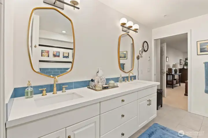 The updated 5-piece primary bath exudes a spa-like ambiance, offering the perfect place to unwind, refresh, and start or end your day in total relaxation.