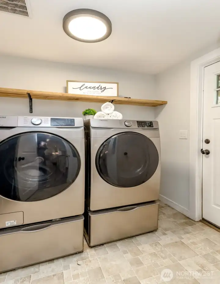 Washer and dryer stay. Extra storage in pedestals. Back door to the right to the covered back porch.