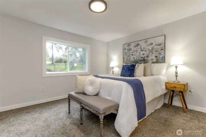 Primary bedroom overlooks front yard.