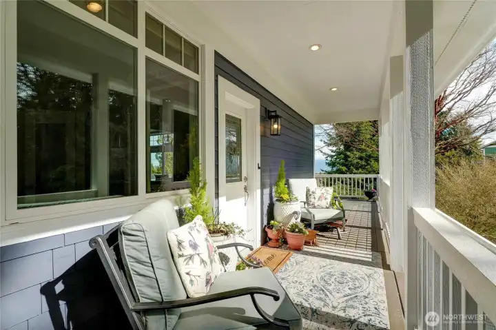 Lovely covered front porcn off the front entry. Enclosed soffits with lighting. Fantastic privacy! Nice.