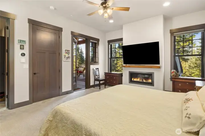 Primary bedroom with exterior door to backyard