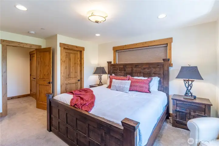 Spacious and sunlit primary king bedroom with an open, airy feel.