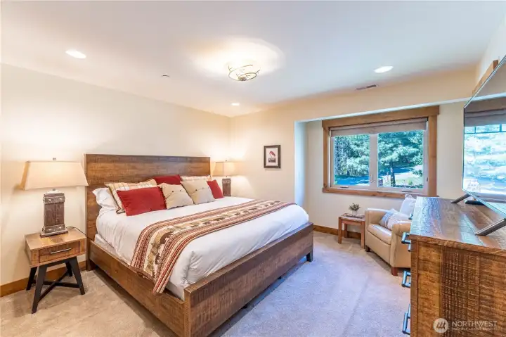 Inviting second king suite with a cozy sitting area, perfect for relaxing.