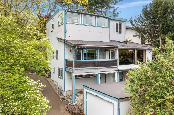 Back Exterior w/Garage. (ADU Entrance at lower level)