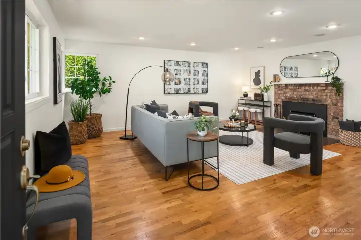 The entry opens up to this spacious living room with hardwood floors.