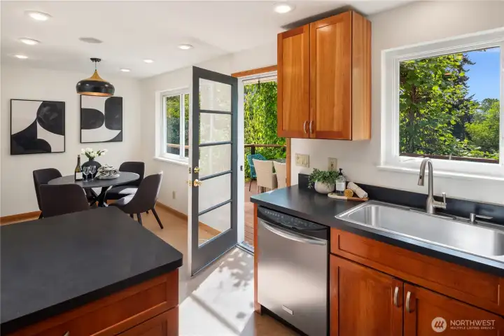 The kitchen opens up to the back deck and ample dining room.