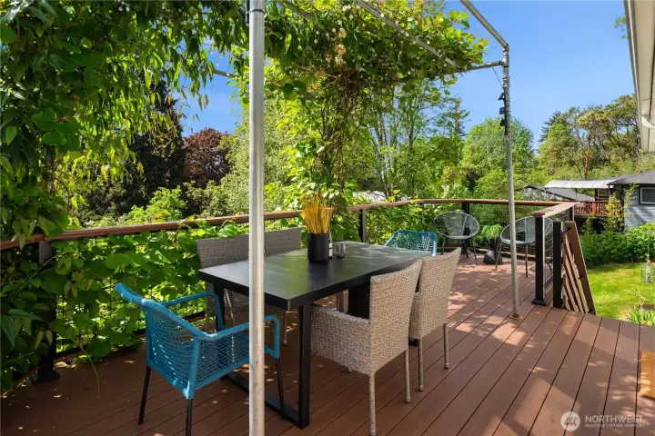 The deck was just redone in 2025 and features low maintenance composite decking with stairs down to the backyard.
