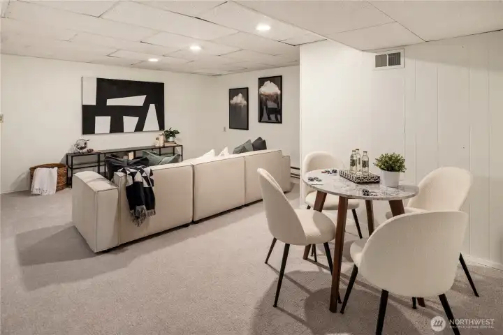This shot of the rec room shows how spacious this room is. It also has great storage off to the left with built-in shelving and a coat closet.