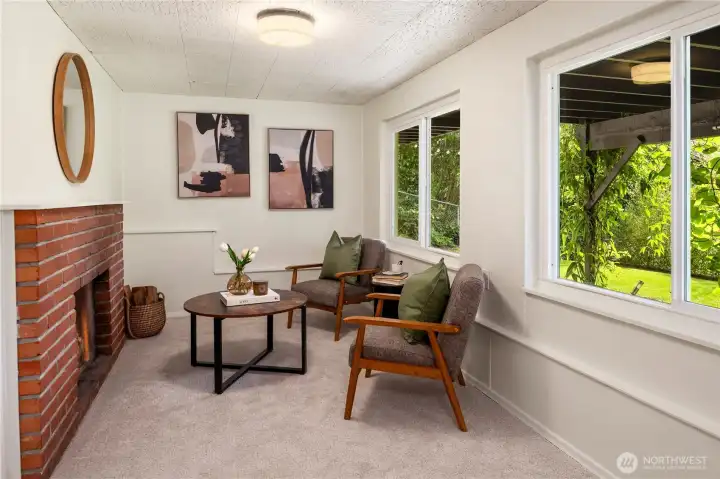 This cozy den area features the third wood burning fireplace and 2 windows.