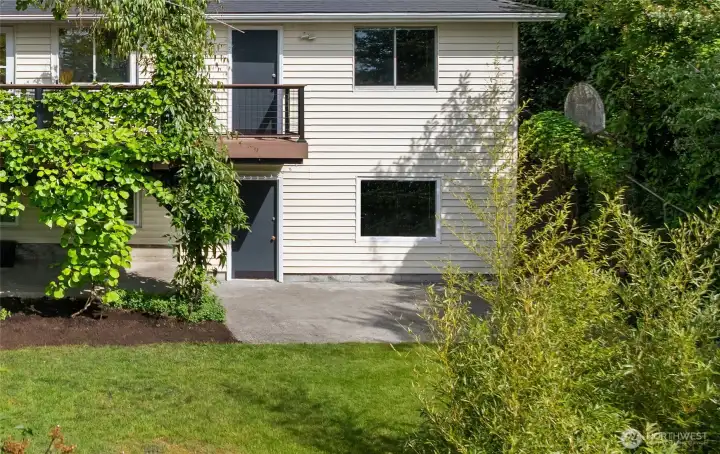 A huge storage room sits off the lower level patio while upstairs another door leads to the 2-car garage with shop.