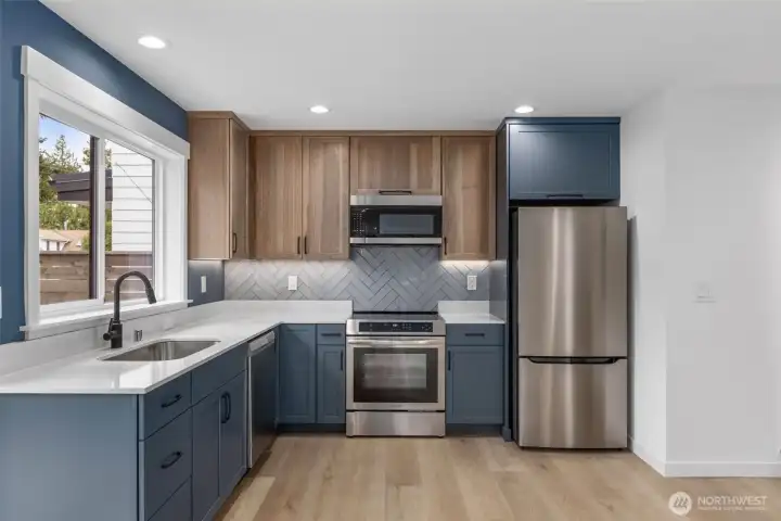 Sleek designer finishes and stainless appliances representative photo