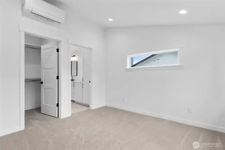 Primary bedroom with ensuite bath representative photo