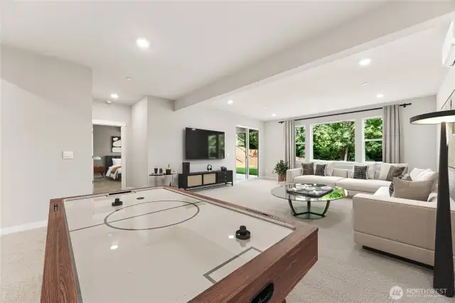 Huge rec room on lower level. Movie room, playroom, game room, lots of options. Photo of actual home with virtual staging.