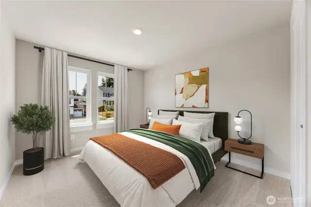Guest bedroom with large windows and walk-in closet. Photo of actual home with virtual staging.