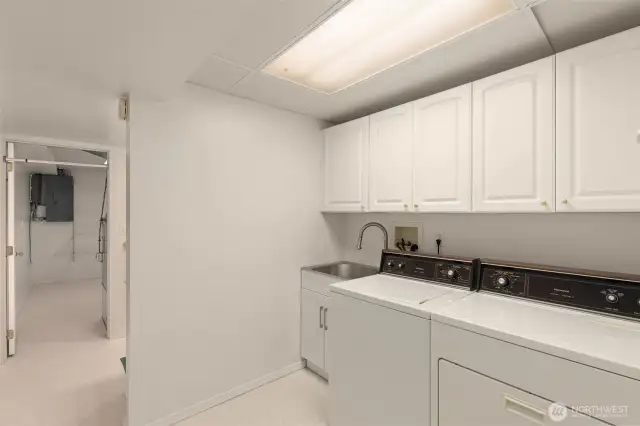 Downstairs utility room w/ utility sink and storage
