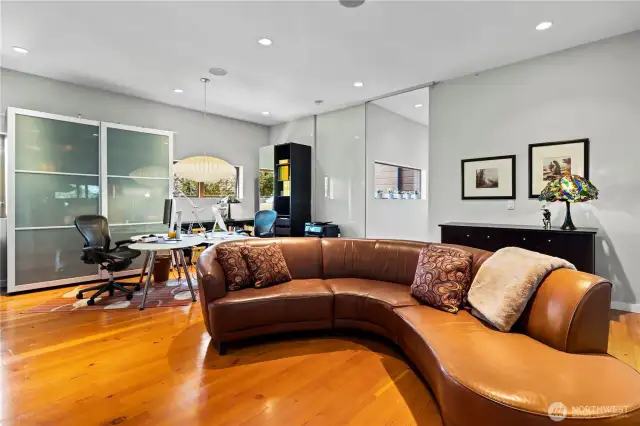 Family room off the kitchen with a sliding privacy door (also has a huge walk-in pantry & media closet!)