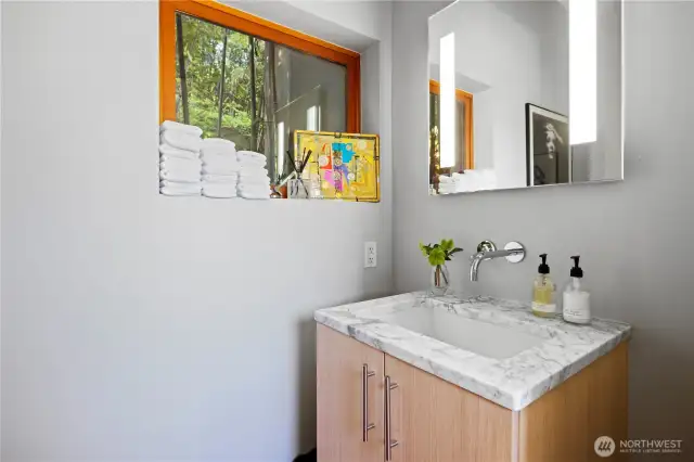 Powder room off the kitchen/dining/family room