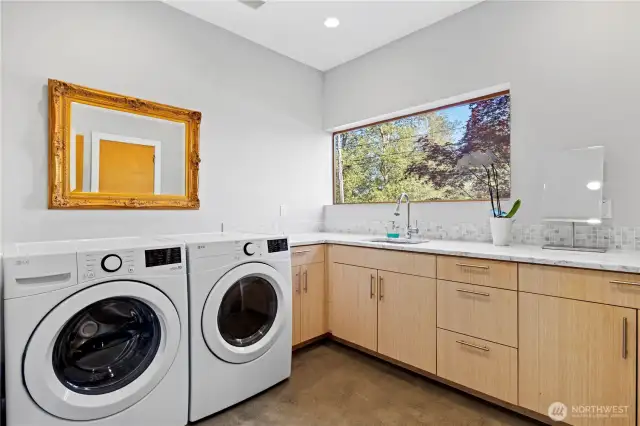 Generous laundry room with walk-in closet