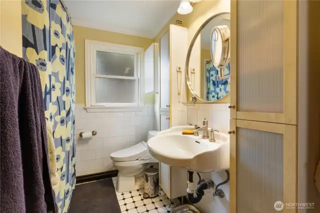 Updated bathroom with modern fixtures and clean design on main level