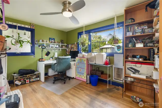 2nd bedroom on main level or versatile bonus room or home office with ample storage and views out back yard