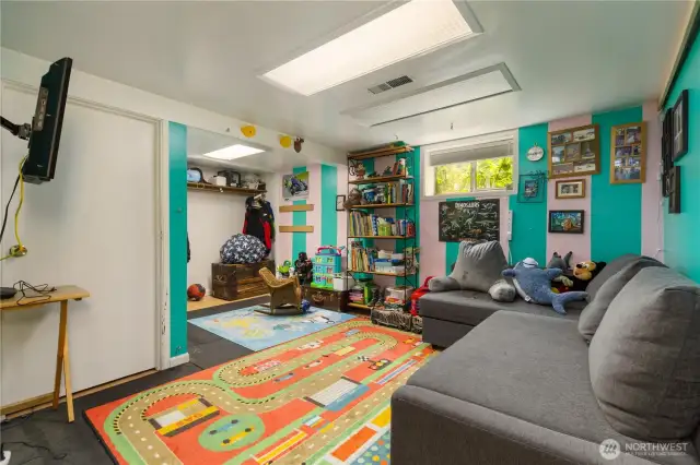 3rd bedroom in basement with lots of color and lots of room for you funiture