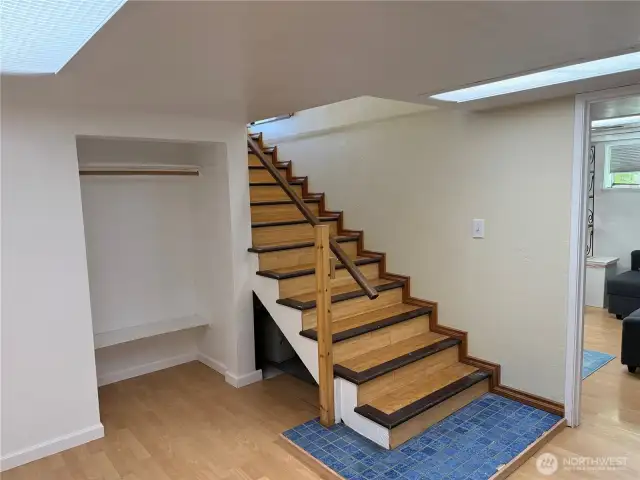 Nice wood stairs leading to lower level bedrooms and bonus room and private sauna