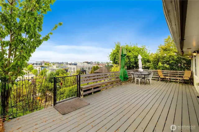 Expansive deck with even more breathtaking sunset city and water view to enjoy year around.  You are surrounded by beautiful gardens and fruit trees also