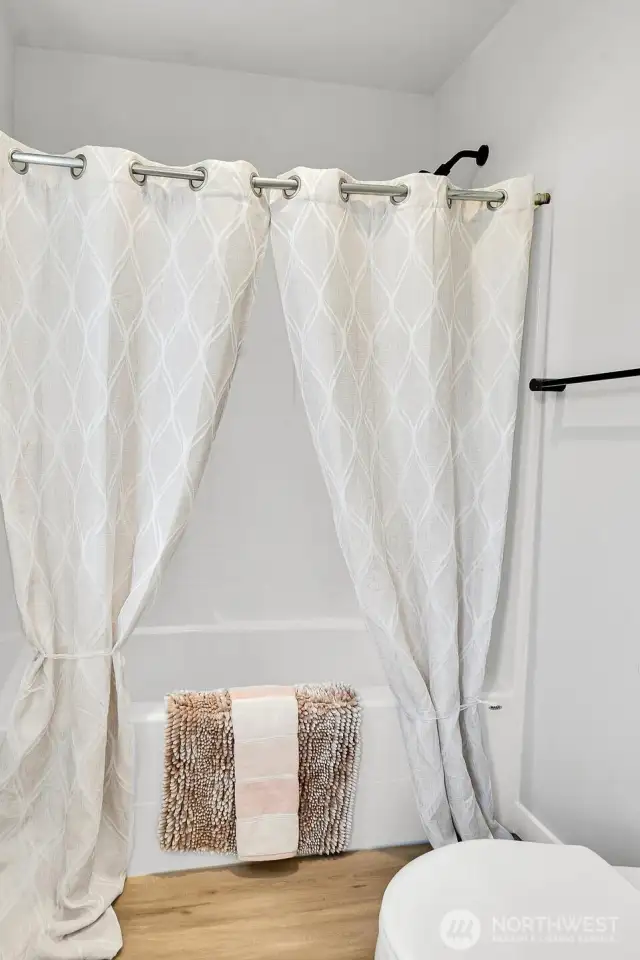 Well-appointed guest bath serves the secondary bedrooms.