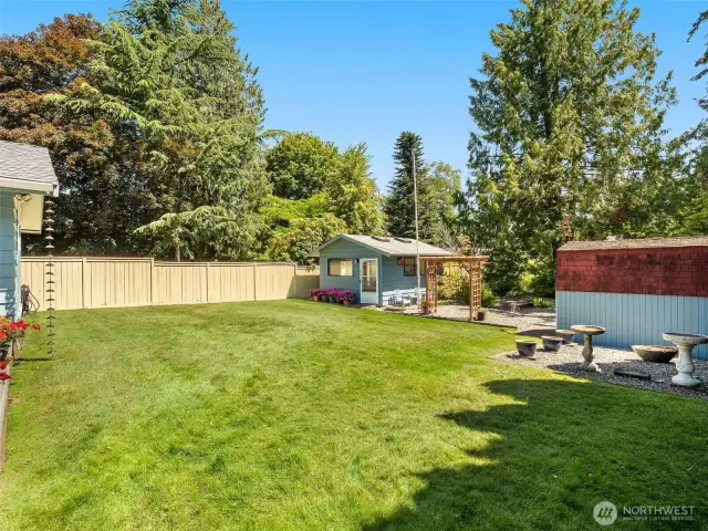 Incredible back yard with well tended lawn.