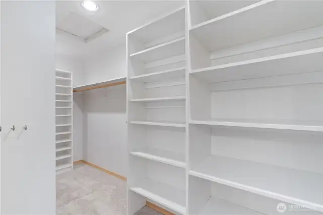 Part of the primary suite walk in closet.