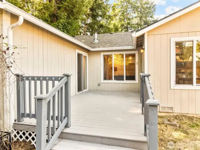 Back deck off the kitchen & primary bedroom.