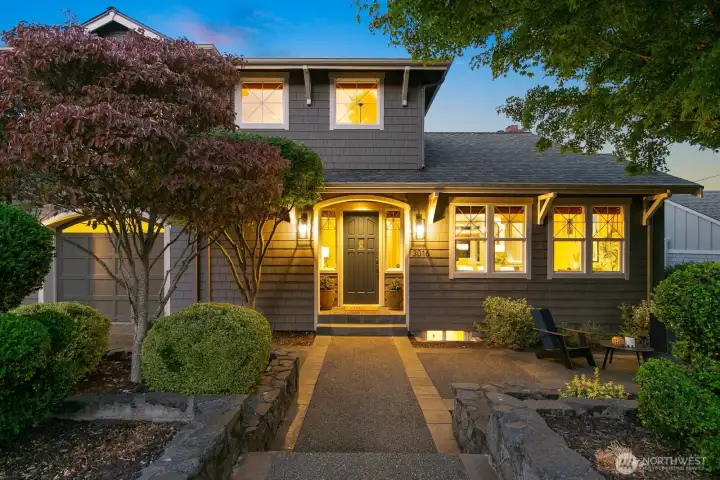 This beautiful home is nearly level-entry and sits atop the east side of the 37th Ave W hill.