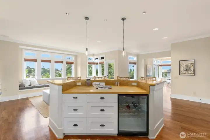 The island has a large butcher block at a lower level than the counter space. Awesome prep spot for the cooks and still allows for a lot of counter space.