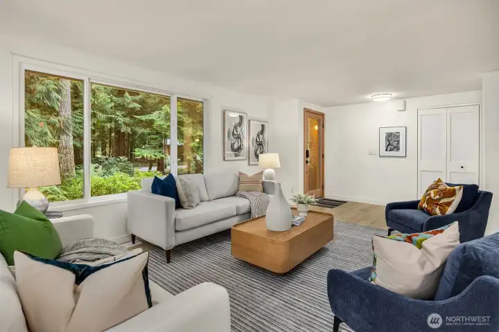 The entry opens seamlessly into the spacious living area, perfect for gatherings.