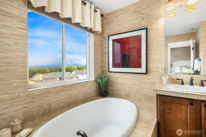 Relax your cares away & enjoy Mount Si views in your corner soaking tub.