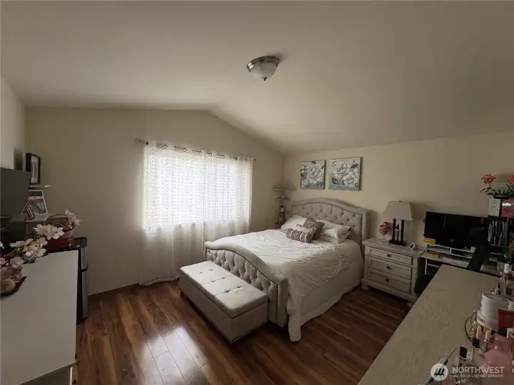 Good size master bedroom with gleaming hardwood floors.