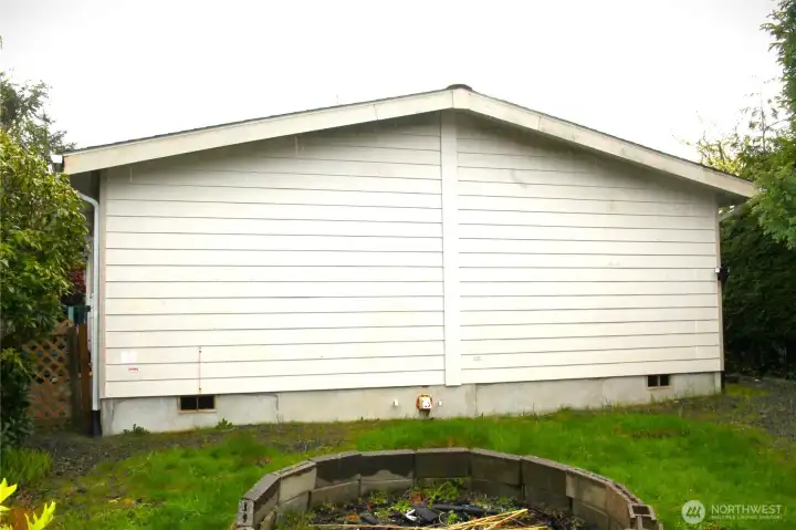 back yard with fire pit.