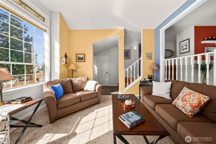 Living room is open to entry and dining area