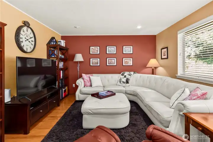 The family room has plenty of room for the entertainment center and all the seating.