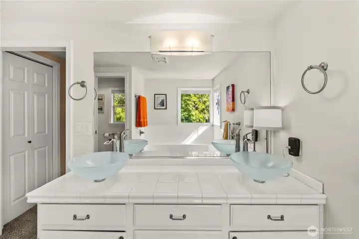 Double Vessel Sinks and Tile countertops in the Primary bath