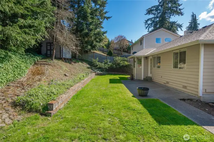 Entertainment sized patio and mature landscaping