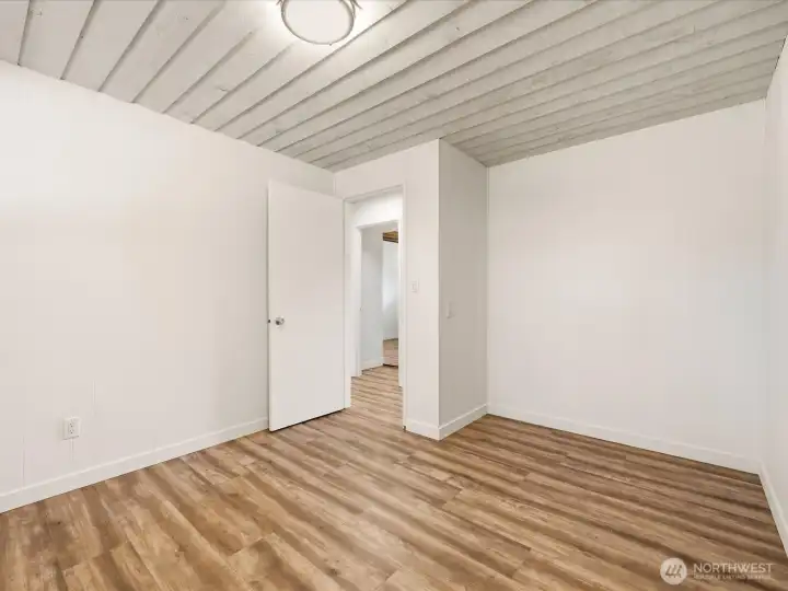 Lower level bedroom 6 without closet doors. 10x13