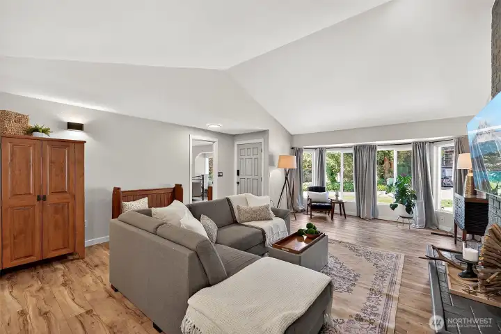 Enter to a Cathedral Ceiling, New Interior Paint "Spun Wool", New Windows, & Laminate Flooring Throughout!