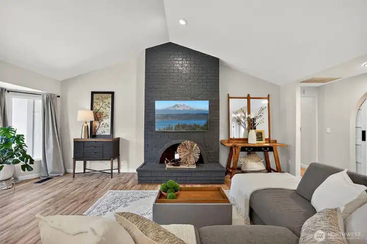 One of Two Fireplaces Centers the Living Room!